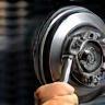 Car brake system service with wheel removed