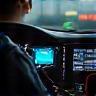 Mechanic using advanced diagnostic scanner in car