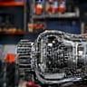Transmission assembly being serviced by a technician